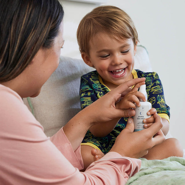 Laughing child and parent about to spray Aroma Fairy Mist together