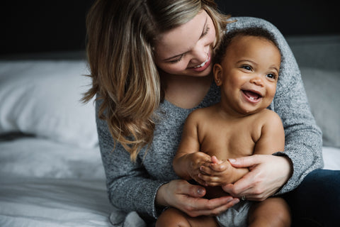 A mother holding her baby