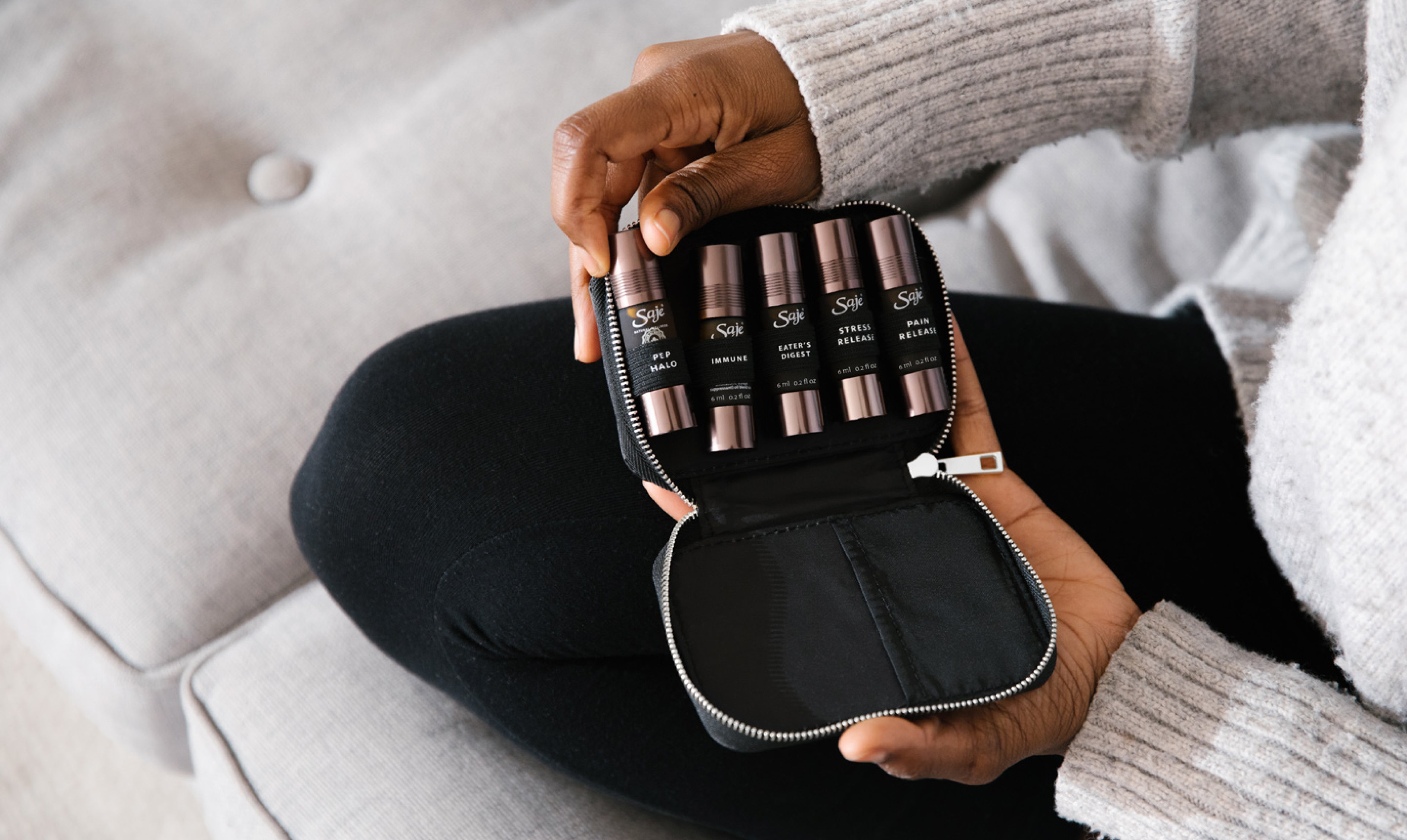 A hand holding an opened pocket farmacy