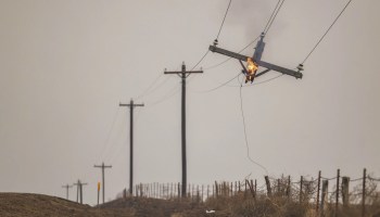 A telephone pole burns from the Smokehouse Creek Fire, Wednesday, Feb. 28, 2024, in Canadian, Texas. (AP Photo/David Erickson)