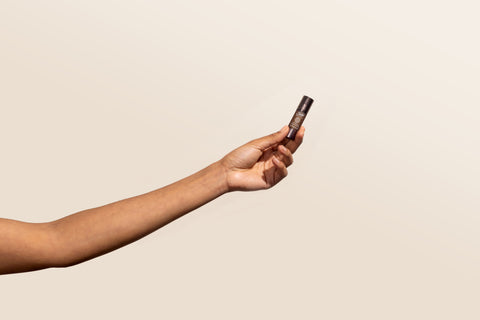 A person holding a confidencce roll-on