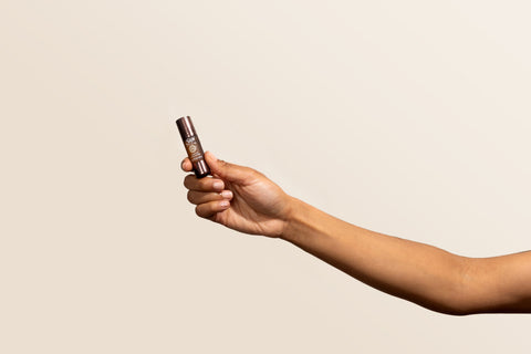 A person holding an unwind roll-on