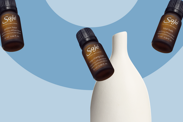 dropping essential oil from a diffuser blend in a diffuser